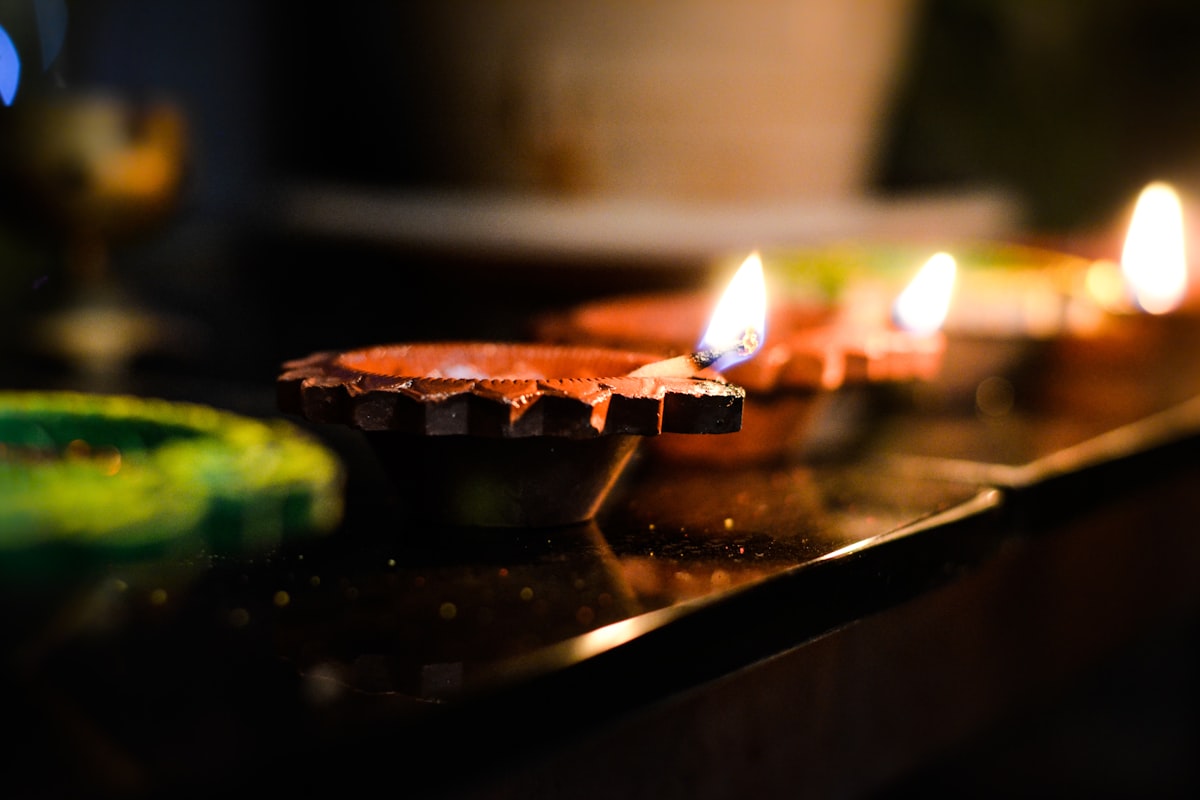 Group of people celebrating a birthday with cultural decorations