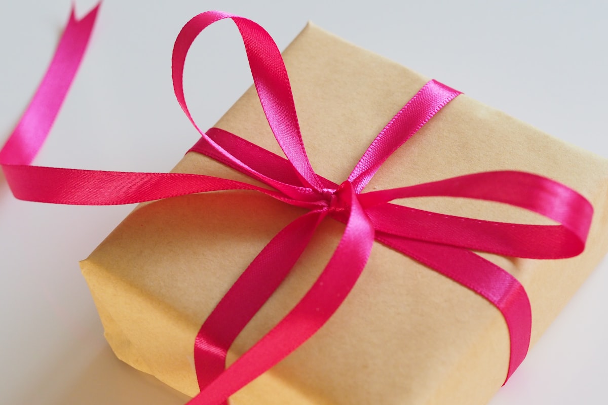 Stack of wrapped birthday gifts in bright colors